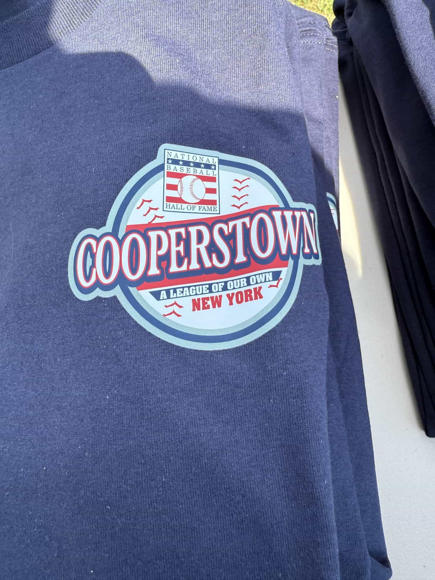 Cooperstown Baseball Hall of Fame logo on navy jacket, New York.