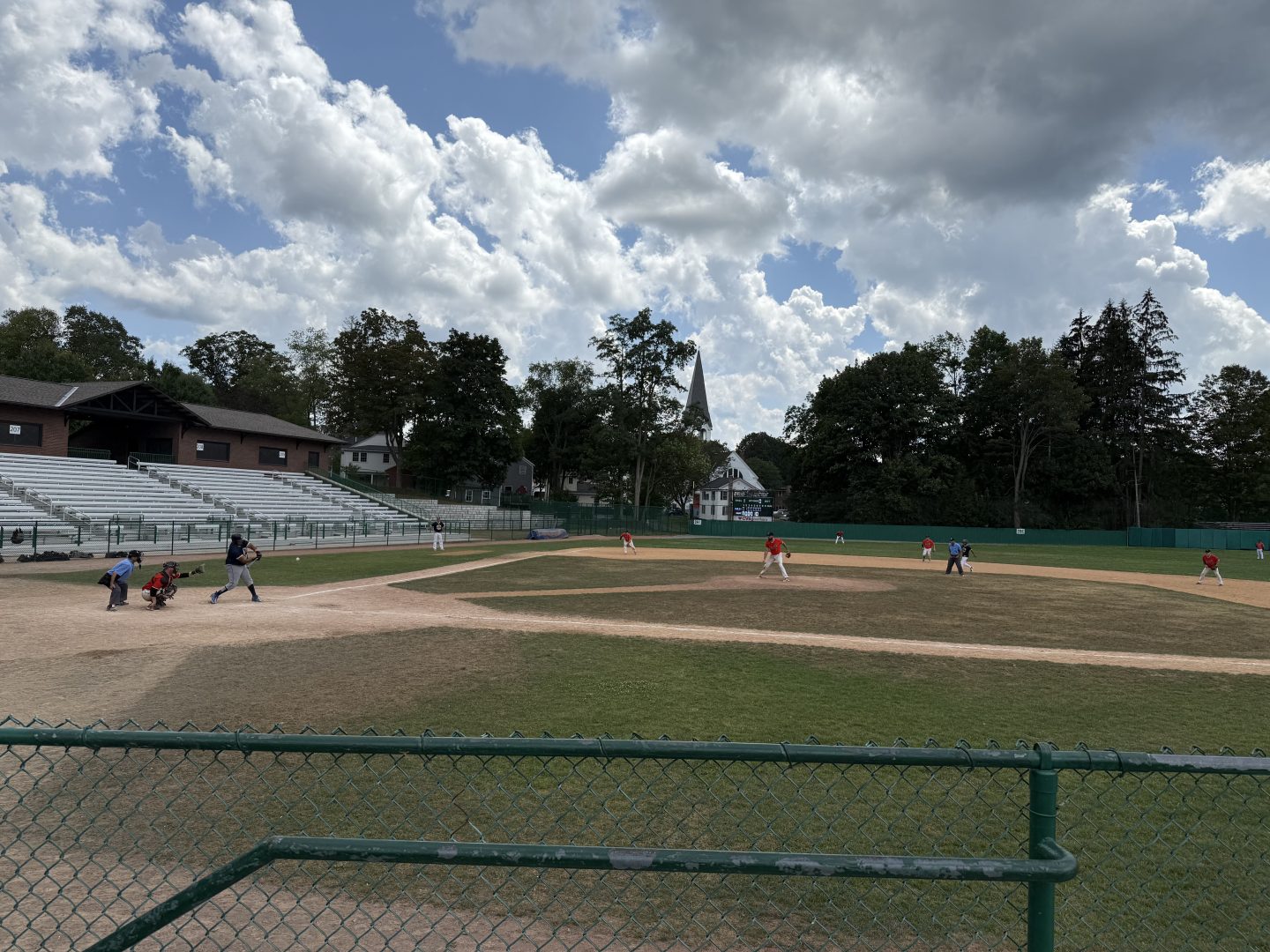 Baseball practice on a sunny day at a local field.