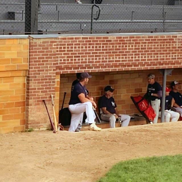 baseball players in the dugout